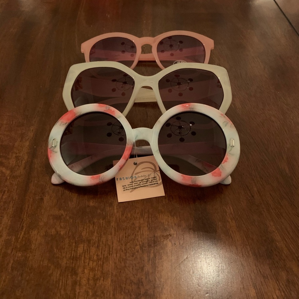 Fashion eyewear three pair of glasses.